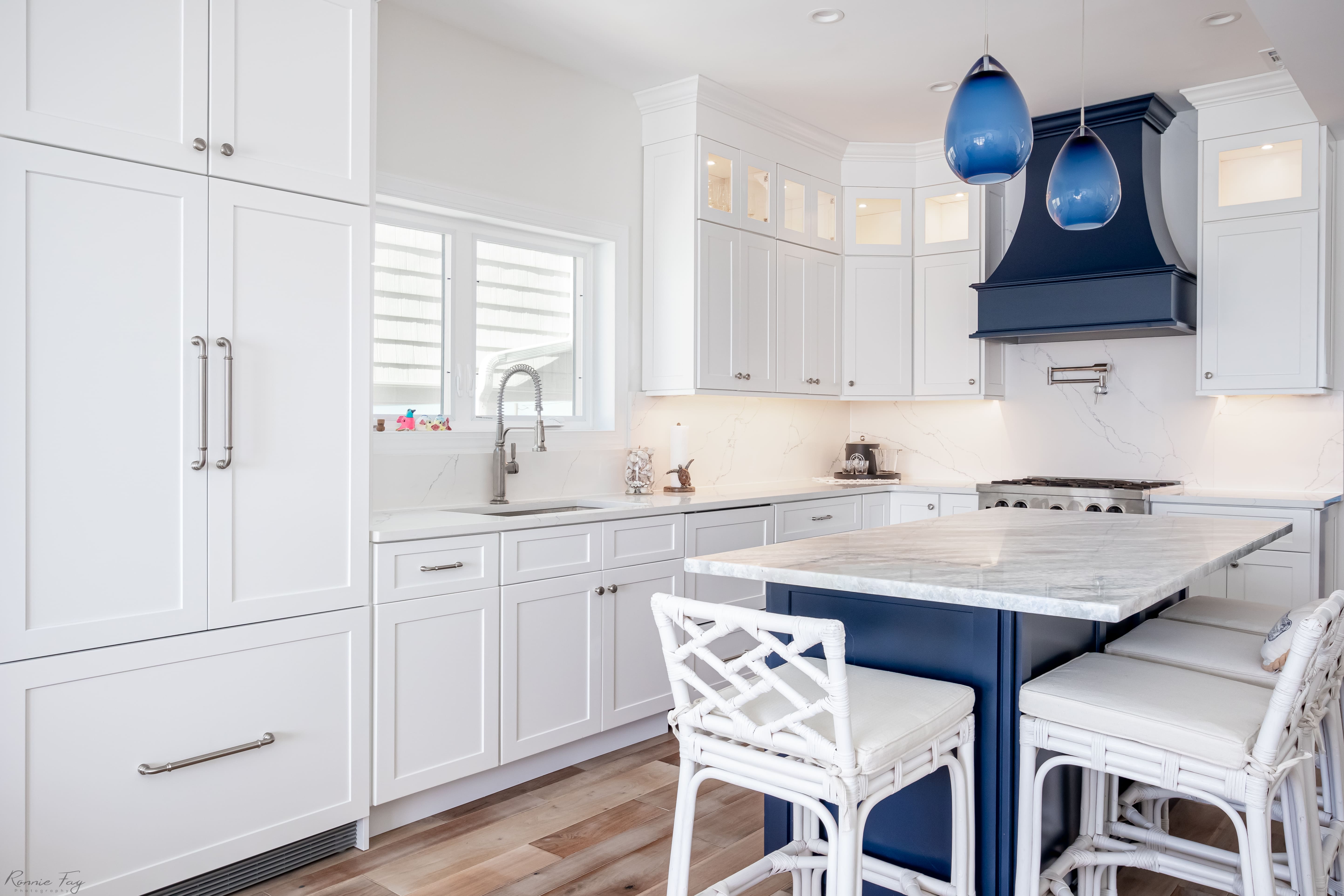 White kitchen cabinetry with island seating — Cape May County, NJ