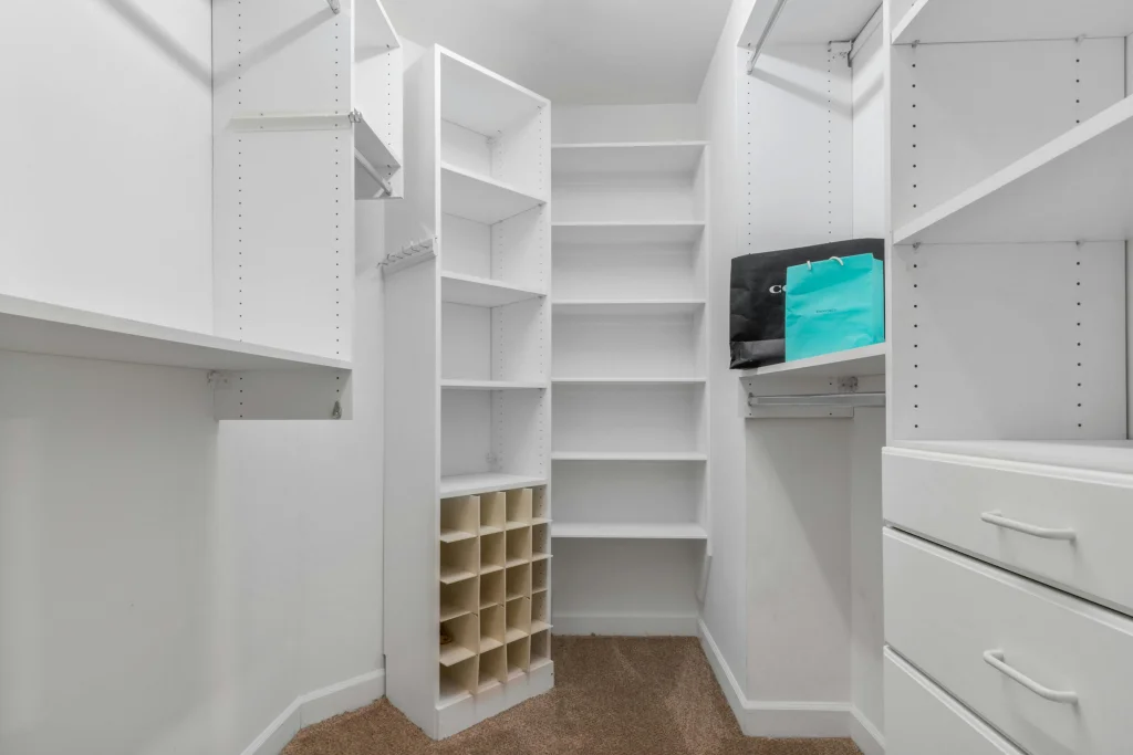 Custom closet system with adjustable shelving and shoe cubbies