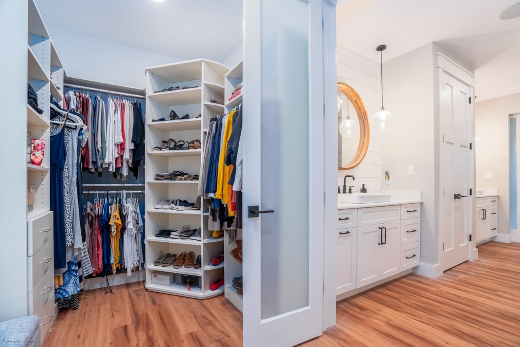 Custom walk-in closet with built-in shelves, shoe cubbies, and dressing area — Cape May County, NJ